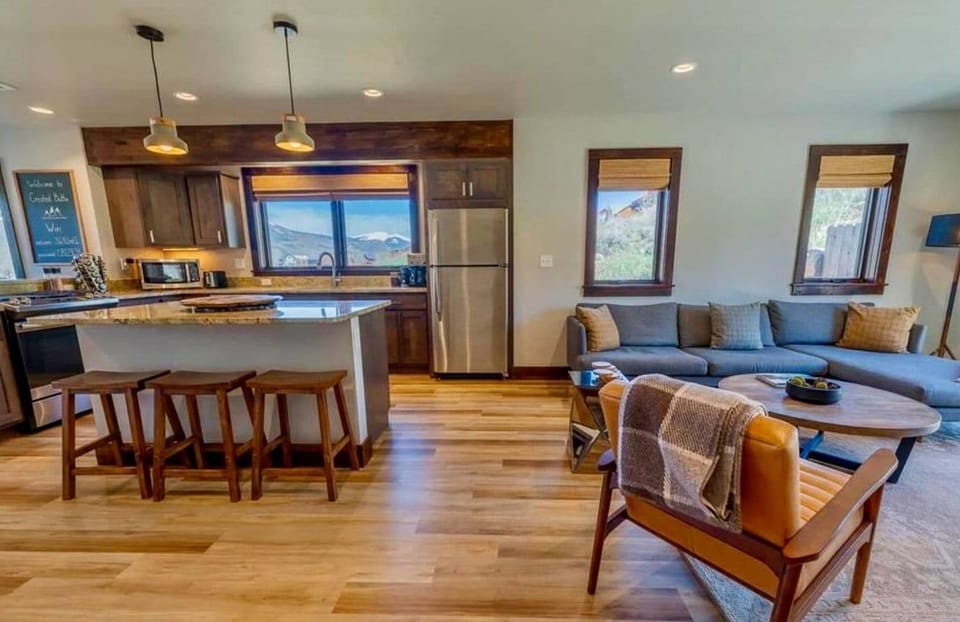 Open concept living surrounded by beautiful views out each window.