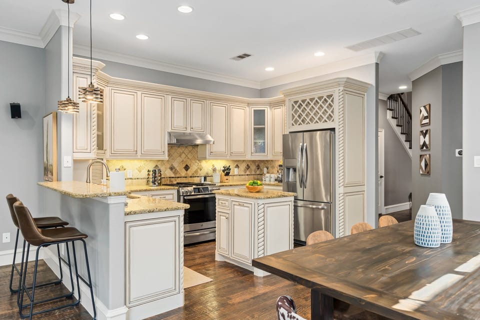 High-quality finishes, stylish fixtures, and top-of-the-line appliances are used throughout this kitchen to create a sleek and modern look while simultaneously providing a functional and efficient space.