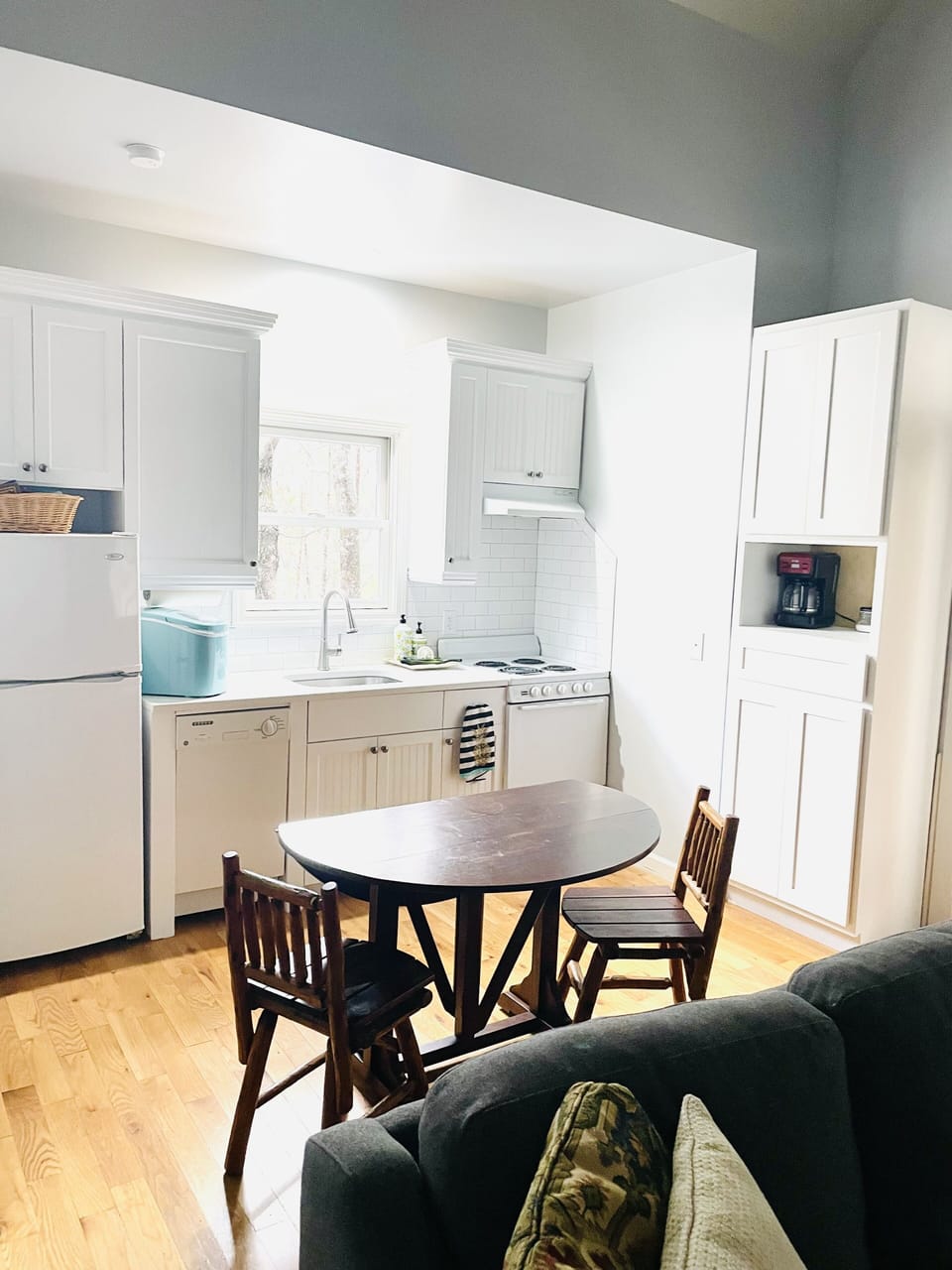 Kitchen with extra ice maker, coffee pot and microwave.