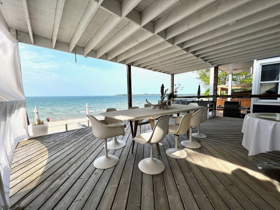 Ground floor deck with a large dining table
