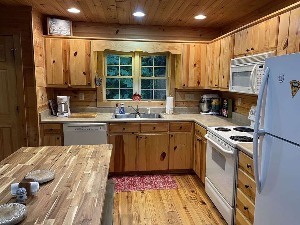 Kitchen with dishwasher, oven/stove/microwave/refrigerator, etc.