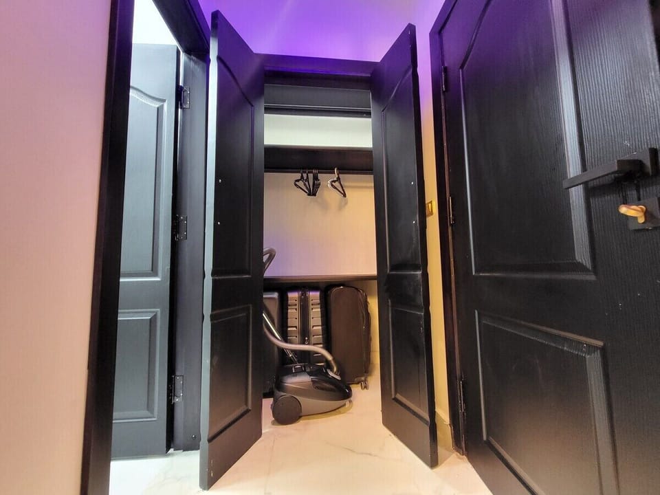 Built-in closet in master bedroom and Panasonic vacuum cleaner available for use