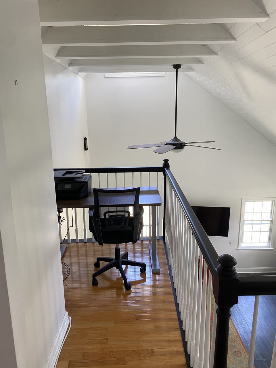 Desk and printer on the landing of the second floor, overlooking the living room