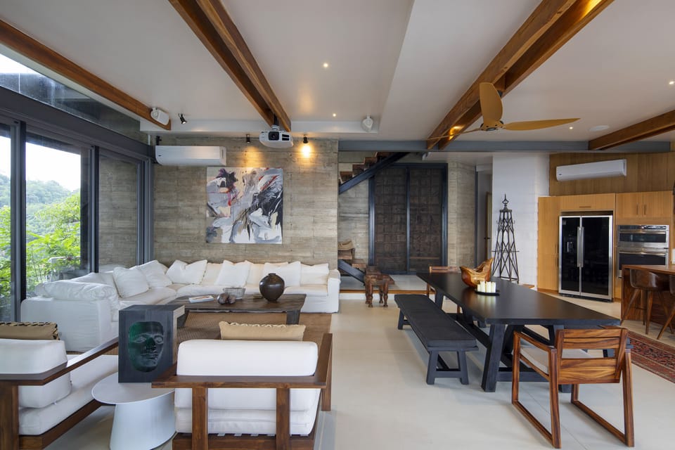 Relax on the oversized sofa with the projector screen or connected sound system