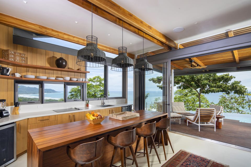 The open plan kitchen blends form and function to perfection...
