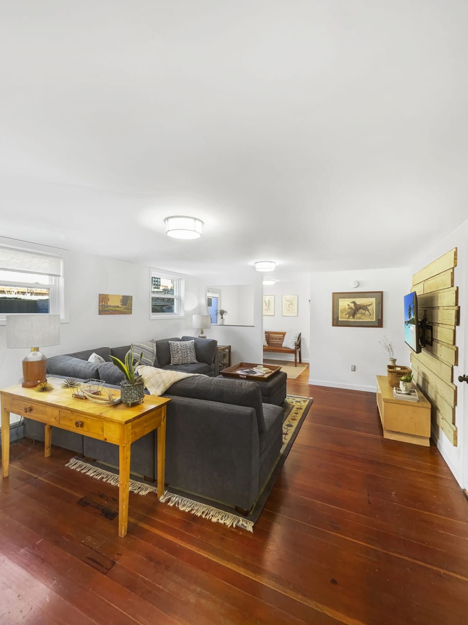 View of living room with entry way in the background.
