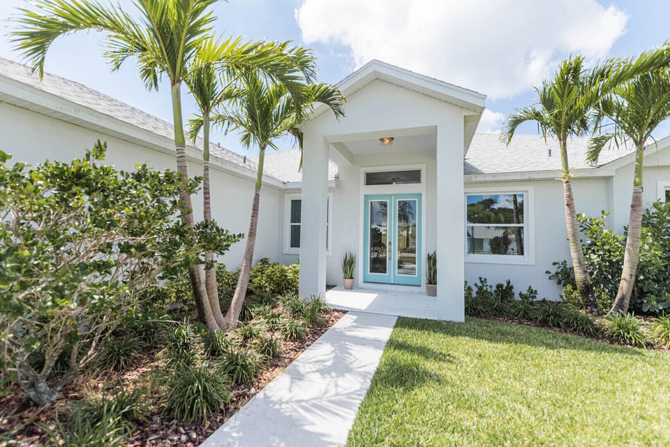 Stroll down a beautifully designed walkway leading to the front door, offering a warm and inviting first impression