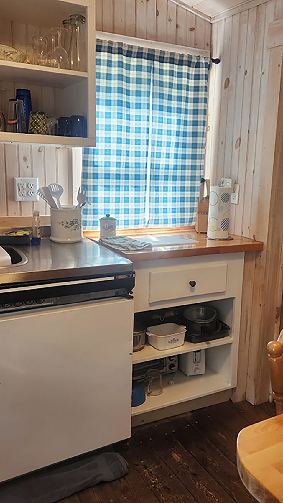 Kitchen includes toaster, toaster oven, microwave, pots and pans 