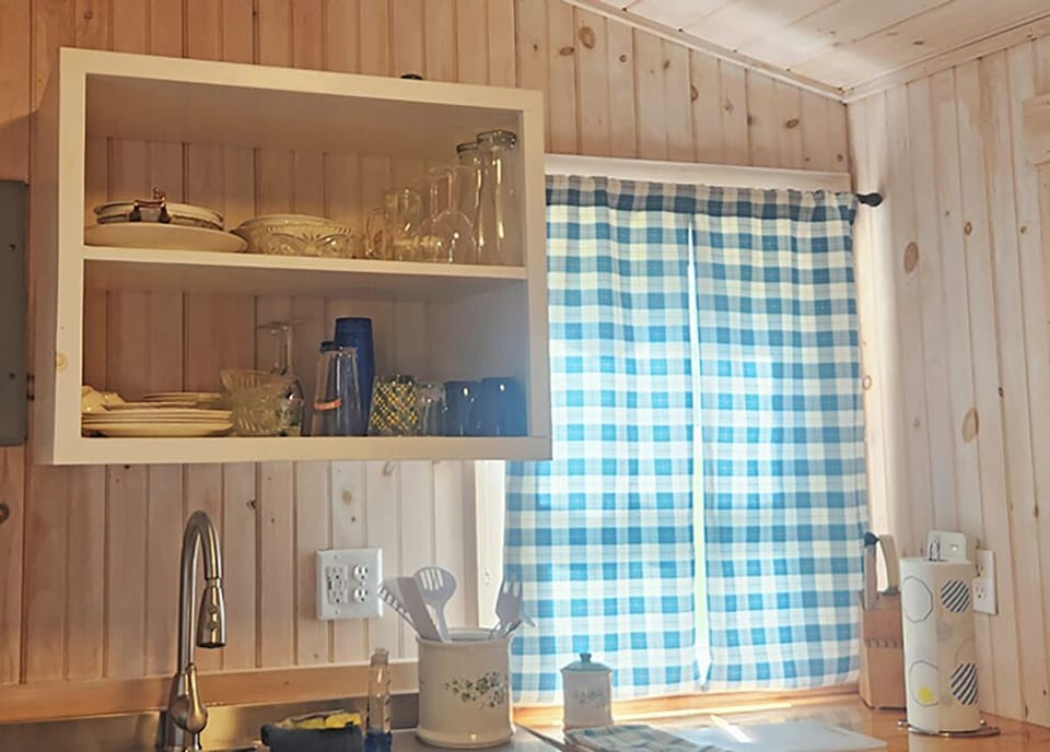 Fully equipped kitchen includes cups and dishes