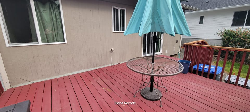 back deck with open fire pit, grassy area