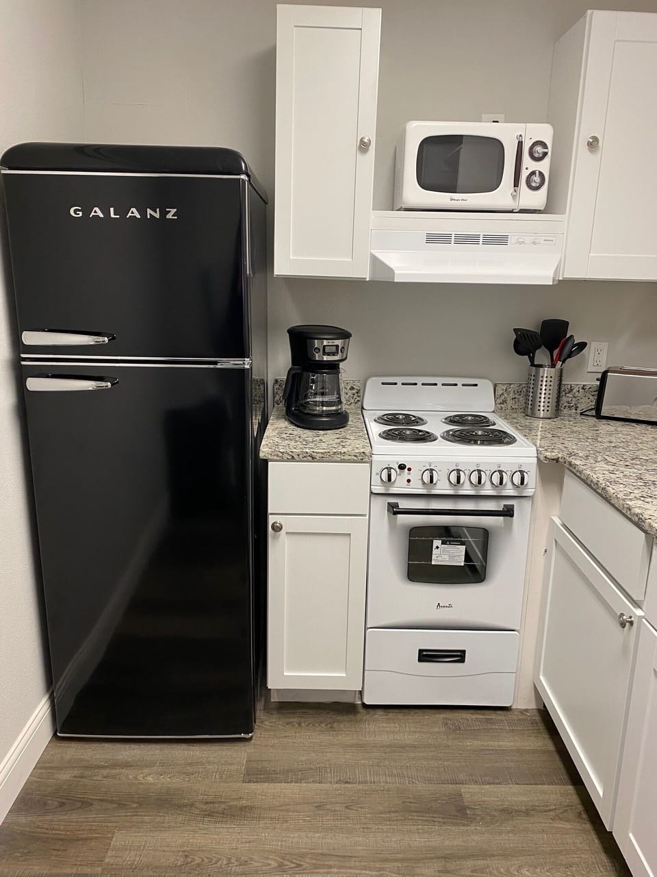 complete kitchen with dishwasher, range , microwave, refrigerator, washer/dryer