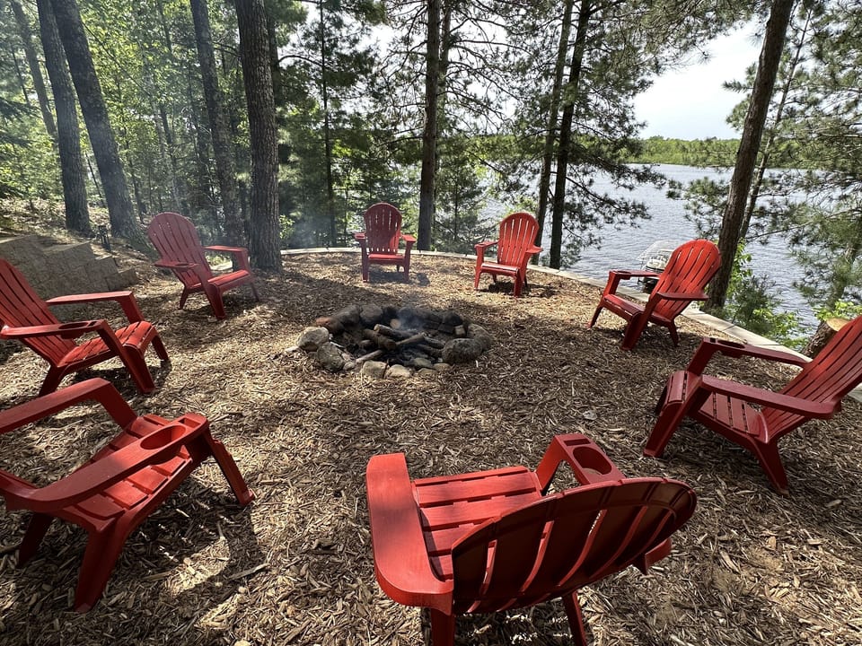 Large lakefront fire pit with plenty of space to relax, view the lake, and look up at the stars.