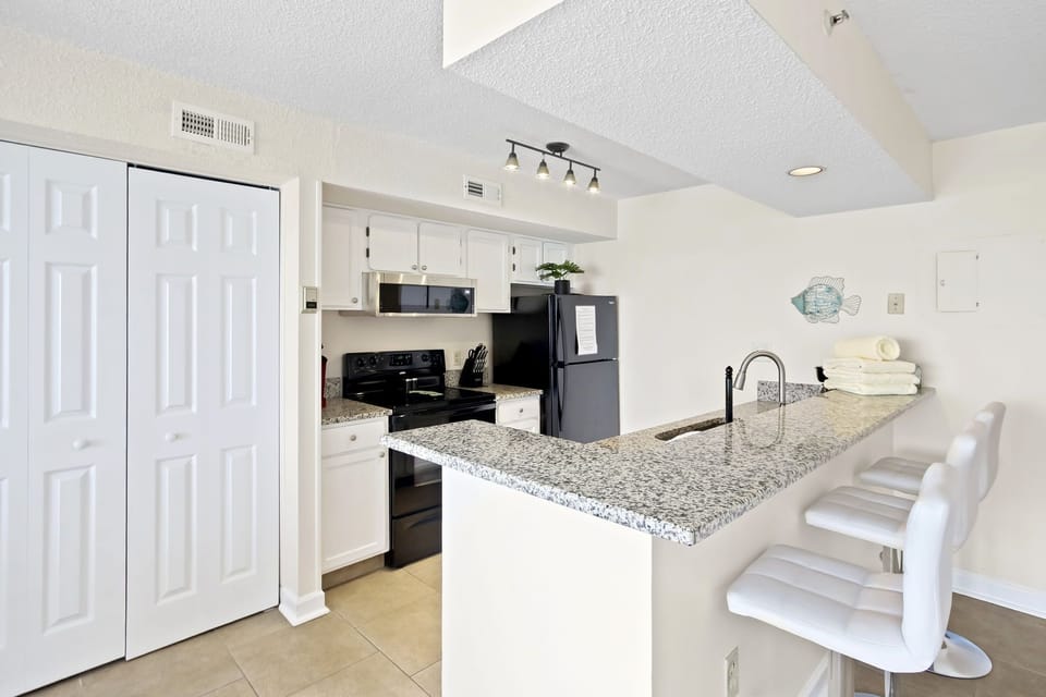 Kitchen with bar height dining for 3.