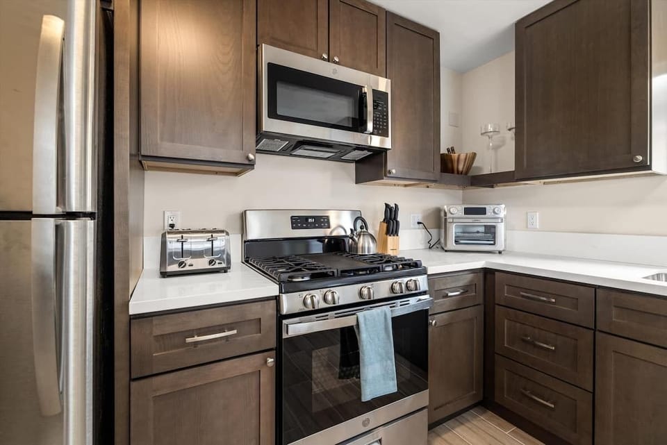 Kitchen with stove, microwave, air fryer & toaster