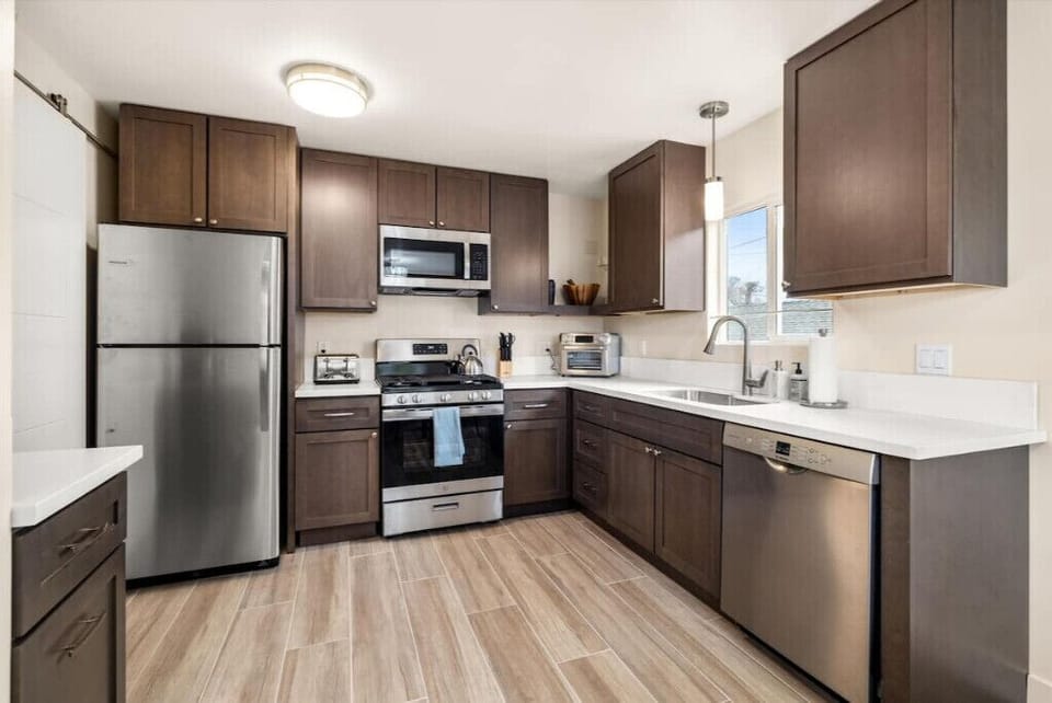 Kitchen with full-size refrigerator/freezer and dishwasher