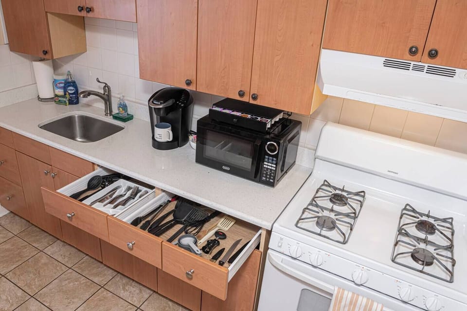 Fully stocked kitchen with Roku coffee maker.
