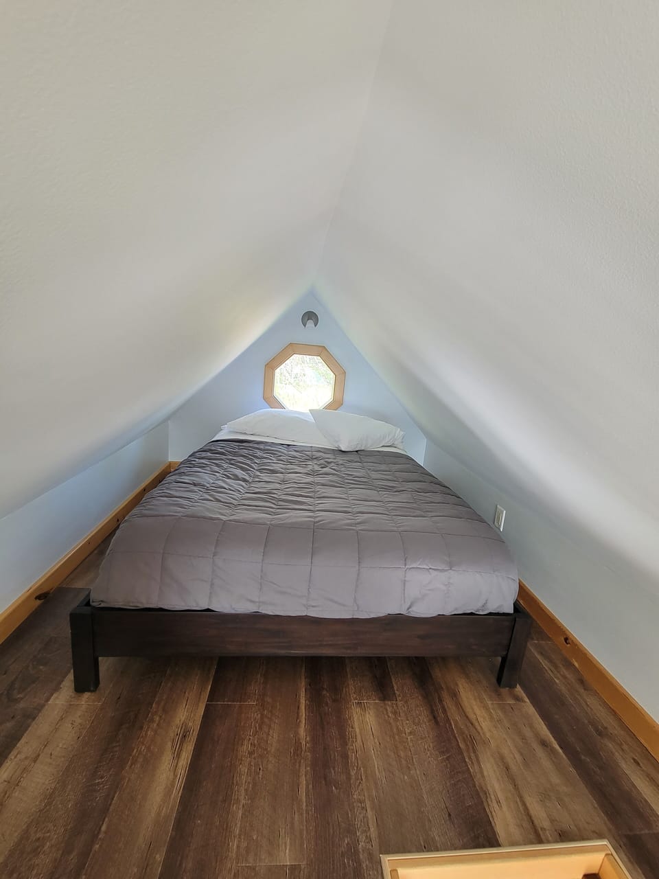 Loft:  Double bed.  Smaller space; the ceiling height in middle of room is 5 ft.