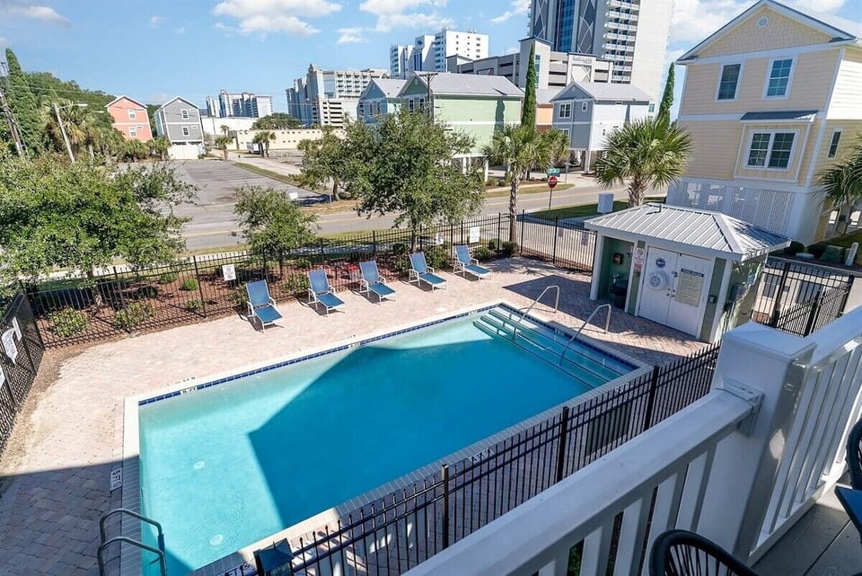 Relax by your fenced-in swimming pool, located just steps from the house and a few short blocks from the beach.