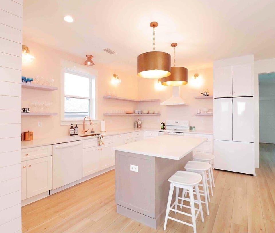 Spacious full-size kitchen with lots of light and sparkling quartz countertops