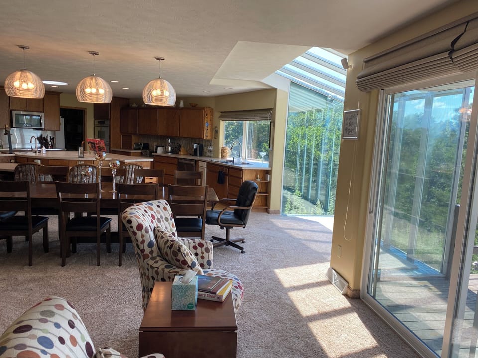 The kitchen, dining room, and sitting room