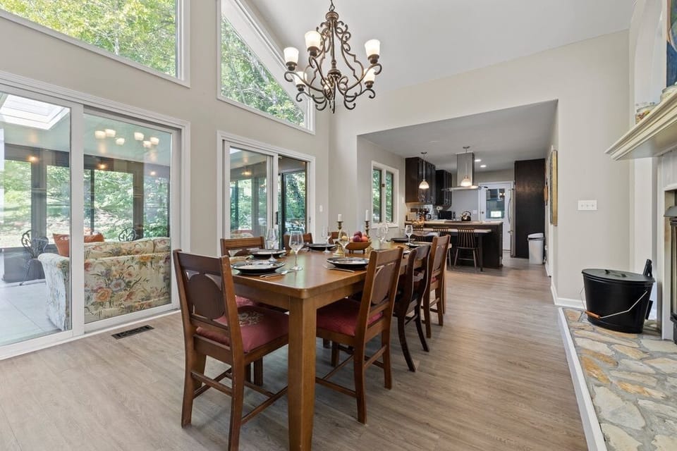 Elegant dining room in between the wood burning fireplace and the sunroom!