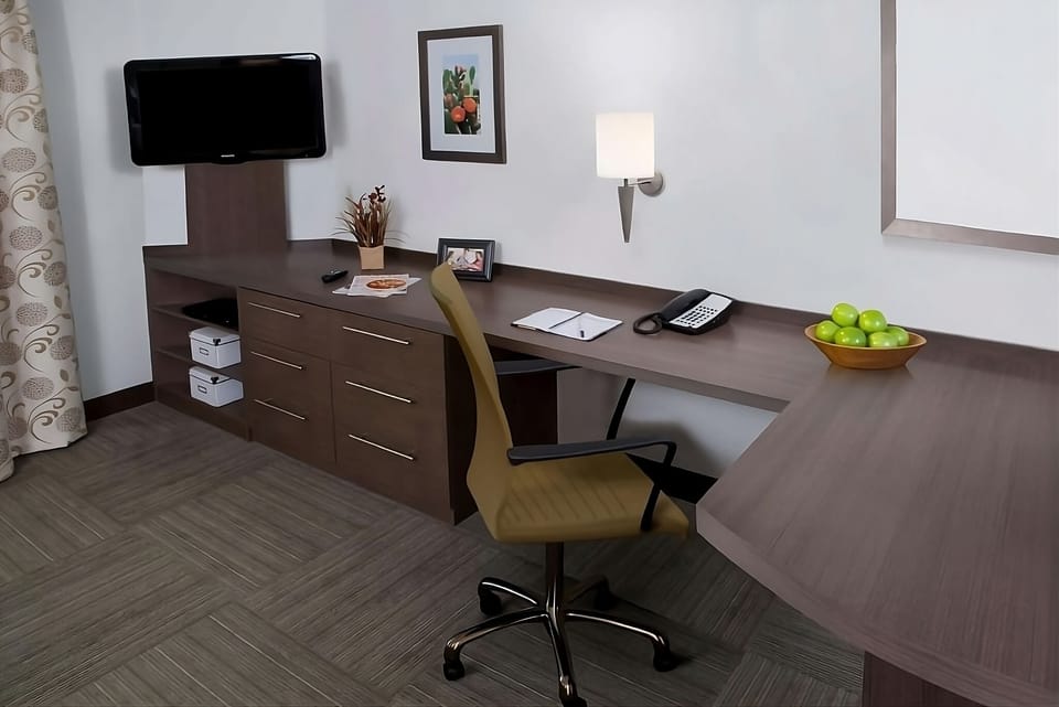 Settle in and focus at the spacious desk workspace.
