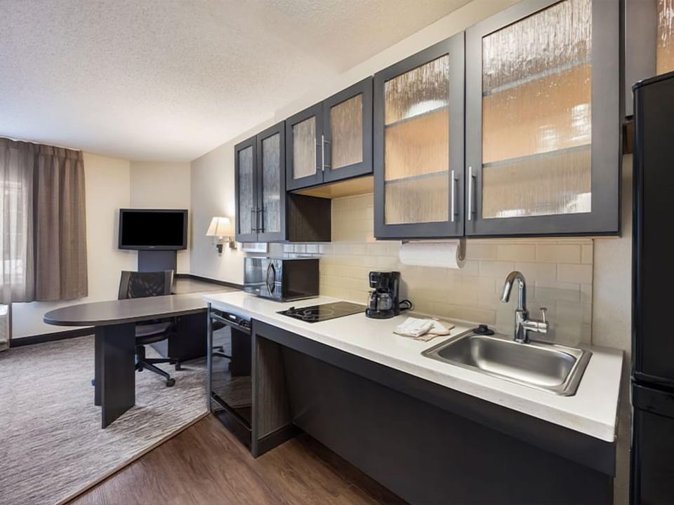 Cook light meals easily with sleek kitchenette and full-size fridge.