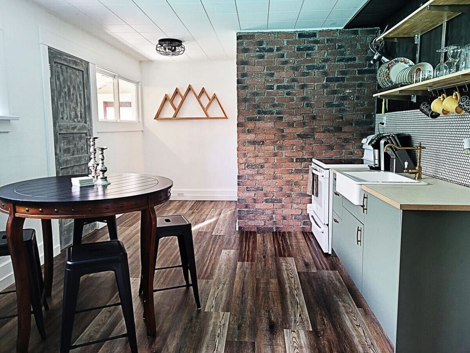 Clean, stylish kitchen for snacking or dining in. Equipped with dishware, pots / pans, and cutlery.