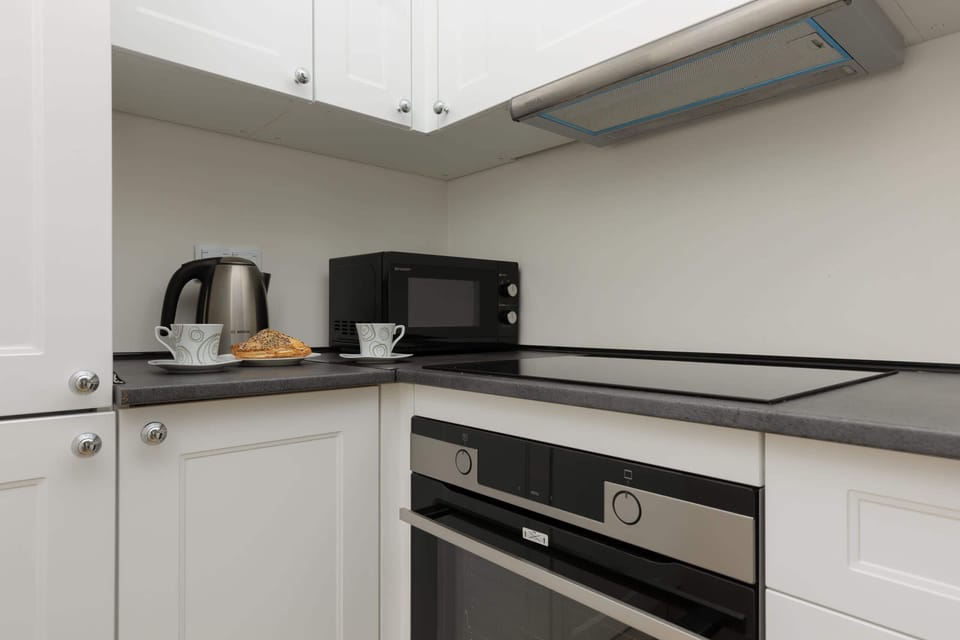 The fully equipped kitchenette includes everything you need for a home-cooked meal.