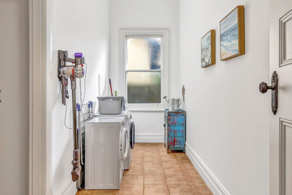 Convenient laundry room equipped with modern amenities.