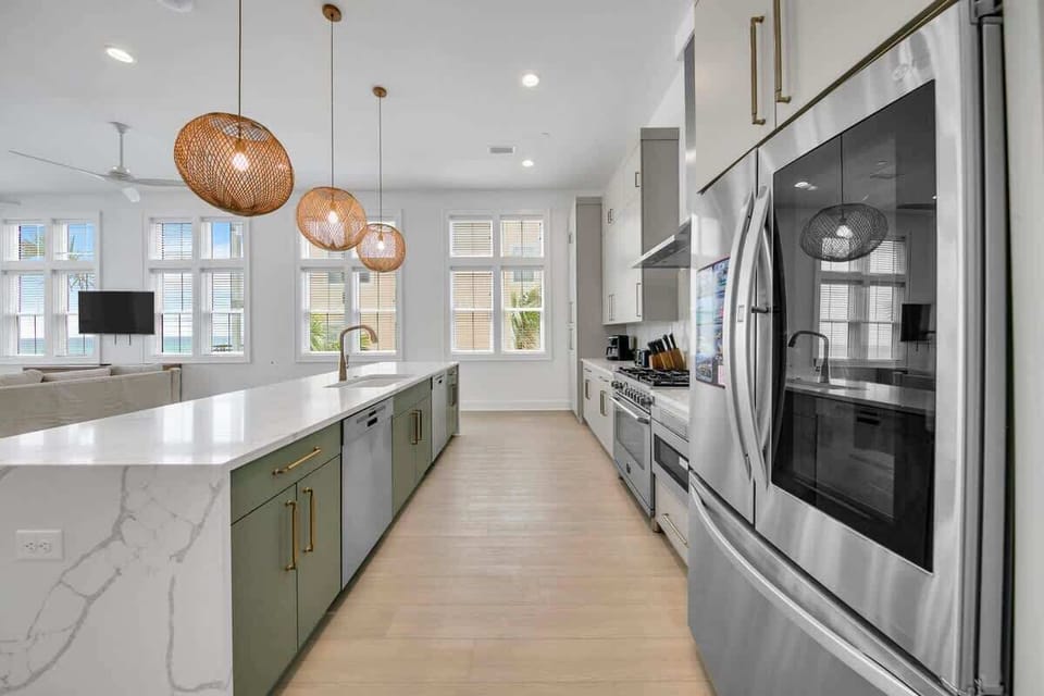 Large open fully stocked kitchen with two dishwashers