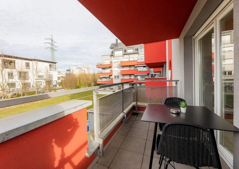 Catch some fresh air on our spacious balcony with a scenic neighborhood view.