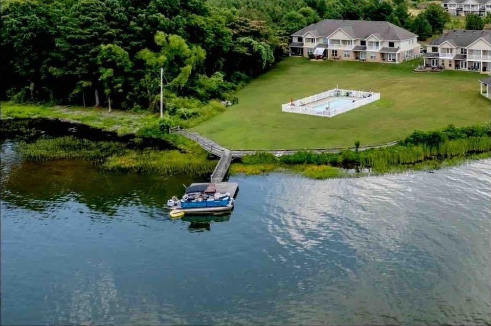 F3 condo is not directly on the lake but lake access is just a short walk from your condo.   Your building is behind the condos shown on this picture.  