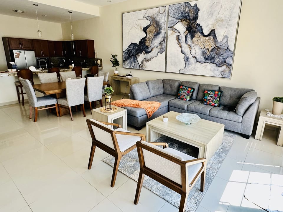 Open concept living room, dining area and kitchen.