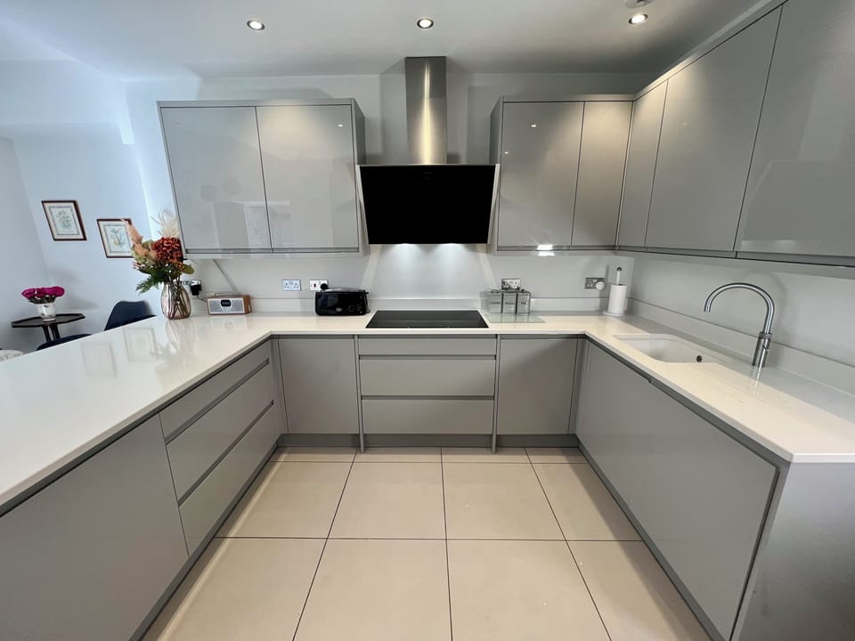 The kitchen is fully stocked for entertaining with induction hob