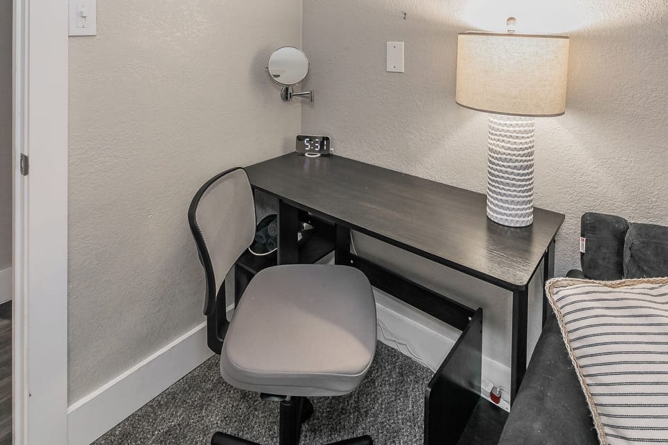 Sleek desk w/ mounted makeup mirror & lamp - perfect for work and beauty routine