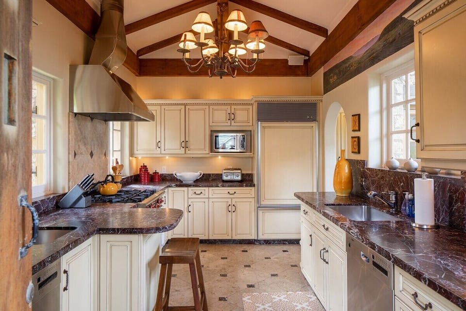 Kitchen with vaulted beamed ceiling.