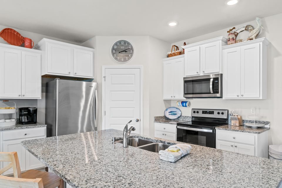 Your fully equipped kitchen features granite countertops, stainless appliances, and everything you need to create memorable meals during your stay.