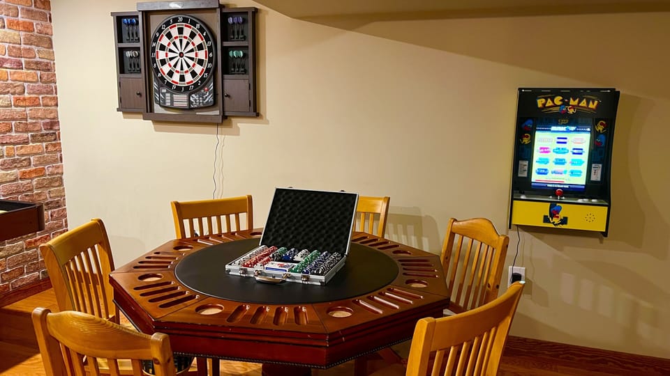 Poker table, pac man arcade 1 game and electronic dartboard