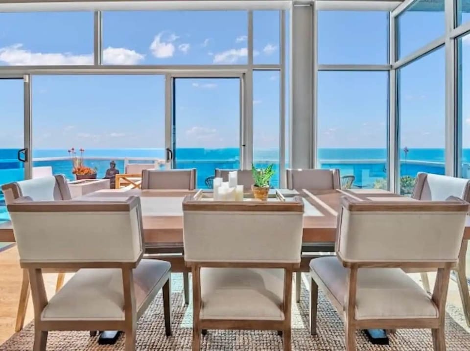 Watch surfers catch epic waves with breathtaking ocean views, all while enjoying the pleasure of a perfect meal in this coastal paradise. 