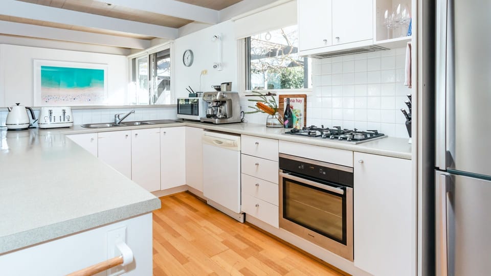 Dishwasher, gas stove top, electric oven, microwave, plus family size fridge and large pantry.