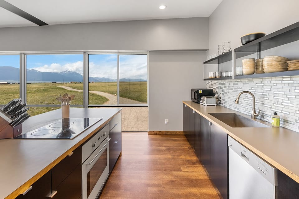 Full kitchen with stainless steel appliances.