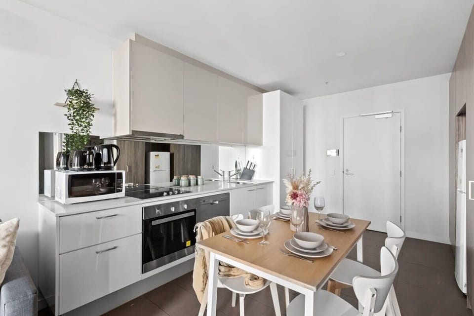 A fully decked kitchen & dining.