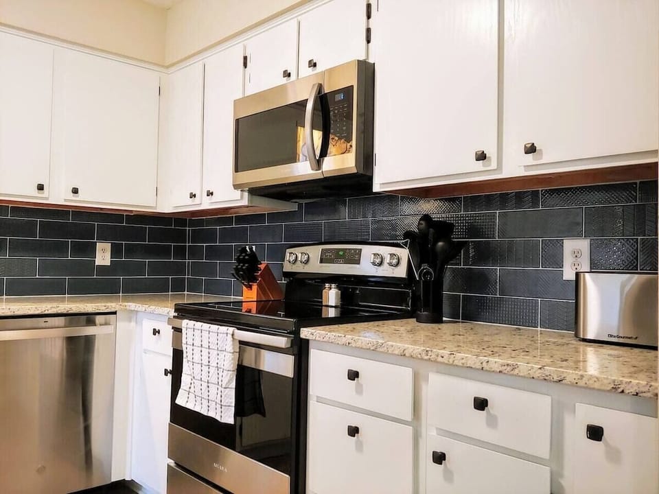 Enjoy cooking up a family meal in the fully stocked kitchen!  (kitchen of 4-bedroom home shown)