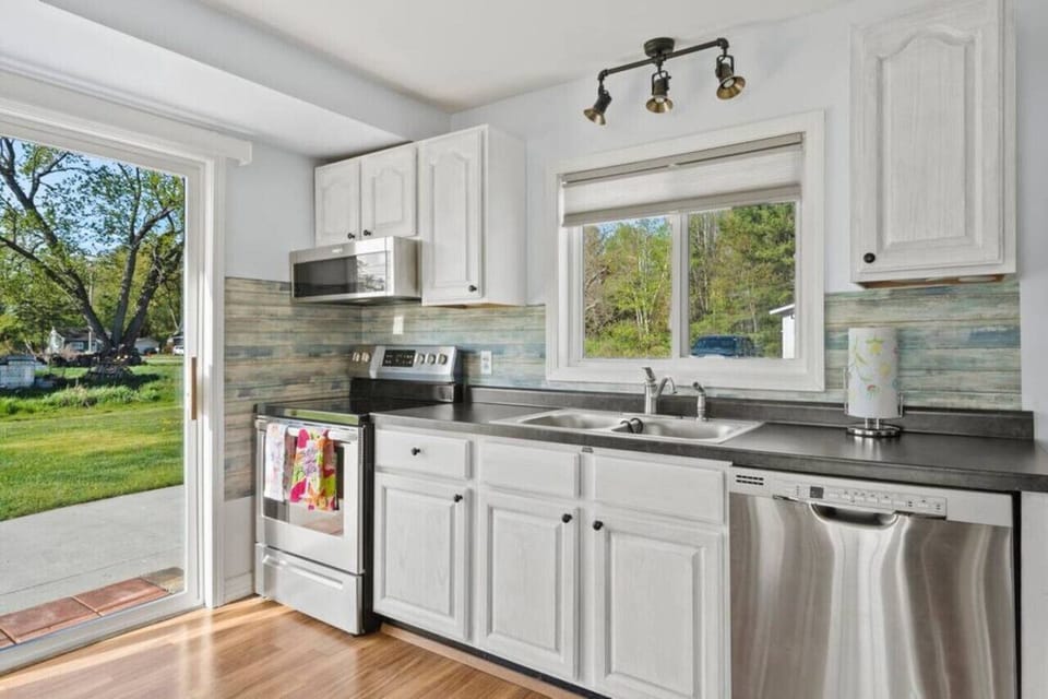 Updated and fully stocked kitchen with stainless steel appliances