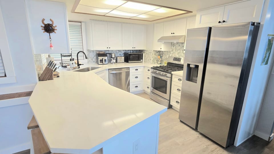 Newly remodeled kitchen with island and extra seating. 