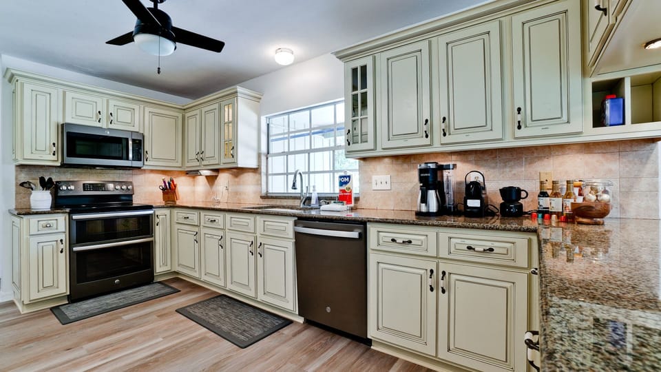 Prepare your meals in this beautiful kitchen with stainless steel appliances.