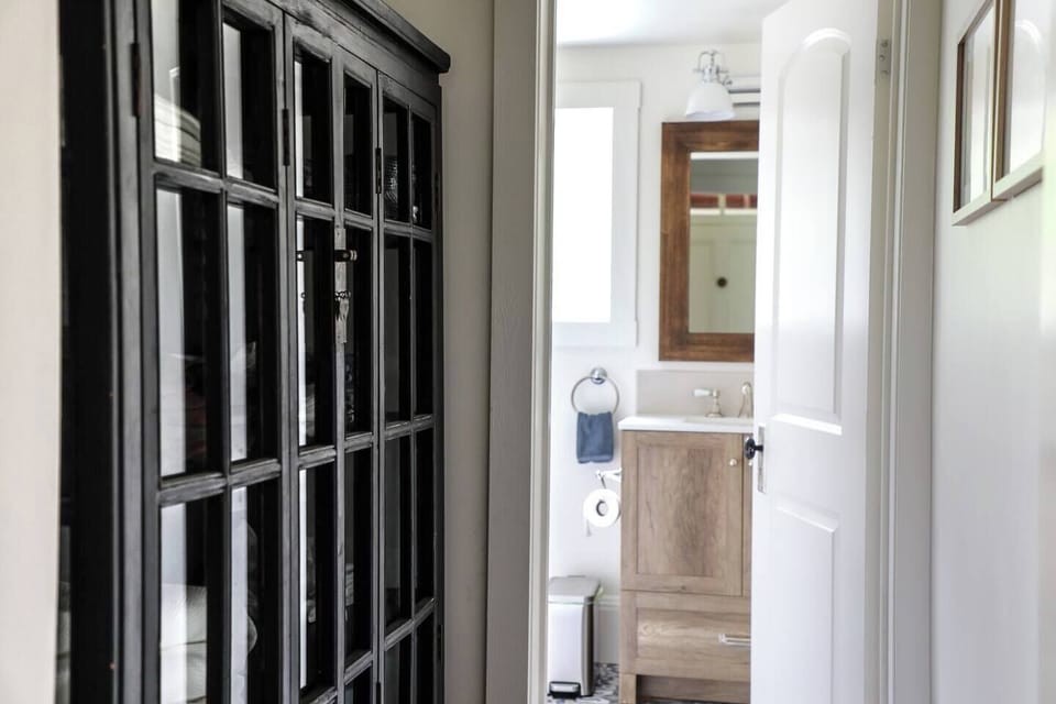 Small hallway to the second downstairs bathroom 