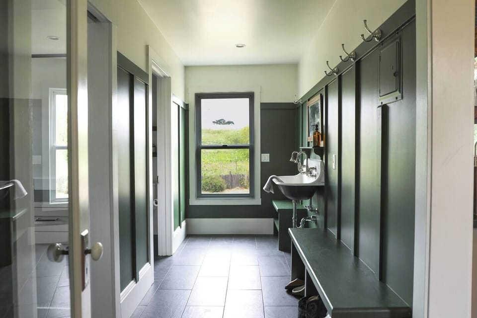 Mud room with full bath, laundry room, and pantry