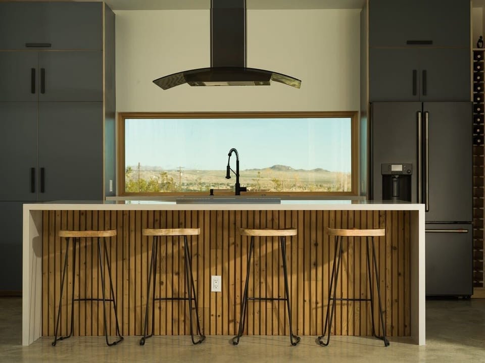 Indulge your culinary desires in our gourmet kitchen, a haven for food lovers and entertainers alike. This meticulously designed space is a chef's dream, boasting high-end appliances, a large island, and an Italian Bertazzoni induction range!